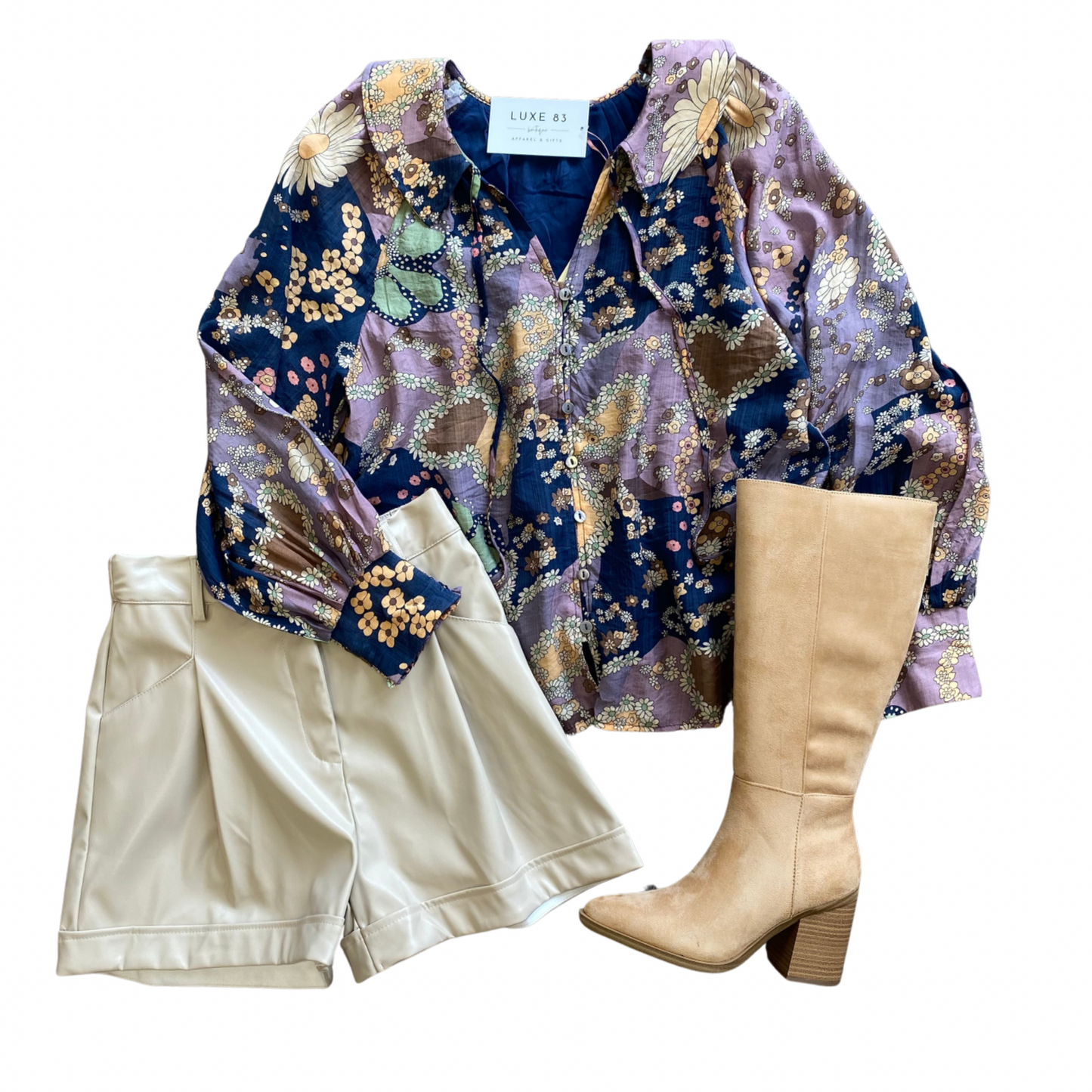A blue and purple long sleeve top with a floral all over print.
